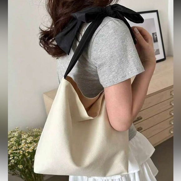 Chic Cream Canvas Tote with Black Bow Handle - Picture 2 of 3